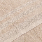 Relax Home Linens beige Egyptian cotton bath towel set featuring a soft plush texture and decorative ribbed border detail