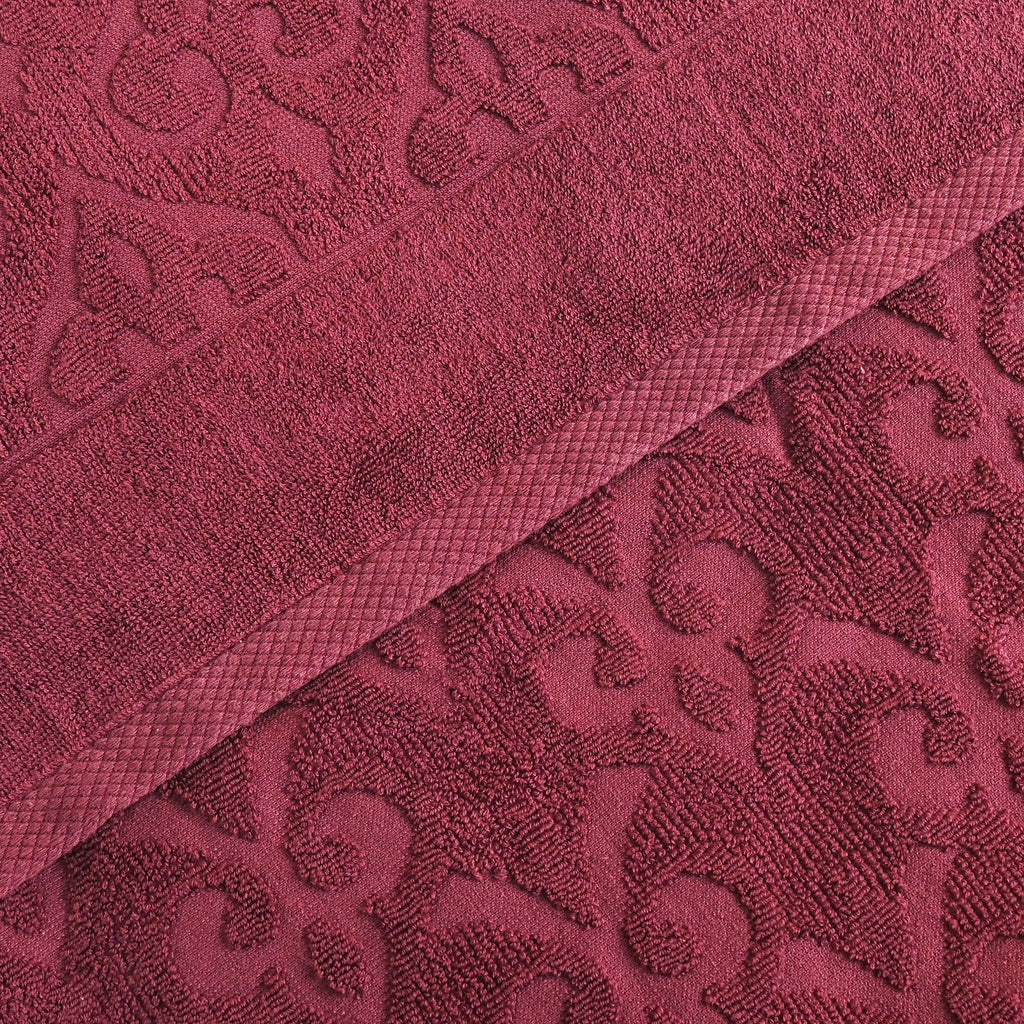 Relax Home Linens Andalus burgundy Egyptian cotton towel set with an intricate embossed damask pattern.