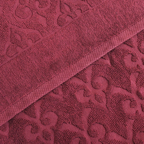 Relax Home Linens Andalus burgundy Egyptian cotton towel set with an intricate embossed damask pattern.